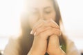 Cute beautiful girl folded her hands in prayer. A woman asks God for help Royalty Free Stock Photo