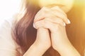 Cute beautiful girl folded her hands in prayer. A woman asks God for help Royalty Free Stock Photo