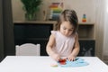 Cute beautiful little two-year-old girl is playing with educational toy Royalty Free Stock Photo