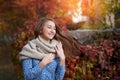 Cute beautiful smile woman walking in red autumn park Royalty Free Stock Photo