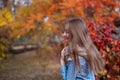 Cute beautiful smile woman walking in red autumn park Royalty Free Stock Photo