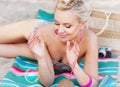 Cute beautiful young woman lying on the beach with vintage color Royalty Free Stock Photo