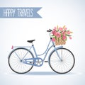 Cute bicycle with basket full of flowers