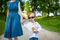 Cute big sister with her toddler brother. Adorable teenage girl holding baby boy. Children with large age gap Royalty Free Stock Photo