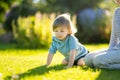 Cute big sister with her toddler brother. Adorable teenage girl holding baby boy. Children with large age gap Royalty Free Stock Photo