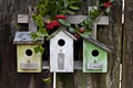 Cute birdhouses on wood fence Royalty Free Stock Photo