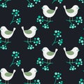 Cute birds on berry branches winter seamless folk pattern. Kitchen textile design print. Dark blue and green colors.