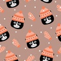 Cute black cat head and mittens hand drawn vector illustration. Winter character seamless pattern. Royalty Free Stock Photo