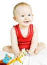 Cute blond baby boy sitting smiling