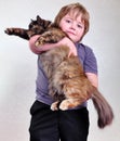 Cute blond boy with a cat Royalty Free Stock Photo