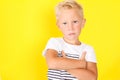 Cute blond boy portrait on yellow background Royalty Free Stock Photo