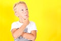 Cute blond boy portrait on yellow background Royalty Free Stock Photo