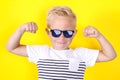 Cute blond boy portrait on yellow background Royalty Free Stock Photo