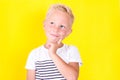 Cute blond boy portrait on yellow background Royalty Free Stock Photo