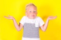 Cute blond boy portrait on yellow background Royalty Free Stock Photo