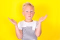 Cute blond boy portrait on yellow background Royalty Free Stock Photo