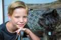 Boy and his friend a brown cairn terrier