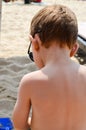 Cute blond child at the beach