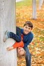 Cute blond child, boy, playing with knitted toys in the park, autumntime Royalty Free Stock Photo