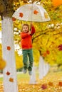 Cute blond child, boy, playing with knitted toys in the park, autumntime Royalty Free Stock Photo