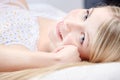 Cute blond girl on pillow