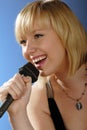 Cute blond girl singing Royalty Free Stock Photo