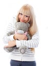 Cute blond girl with a Teddy bear Royalty Free Stock Photo