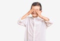 Cute blond kid wearing elegant shirt covering eyes with hands smiling cheerful and funny Royalty Free Stock Photo