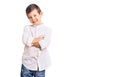 Cute blond kid wearing elegant shirt happy face smiling with crossed arms looking at the camera Royalty Free Stock Photo