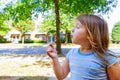 Cute blond little girl blowing a dandelion Royalty Free Stock Photo