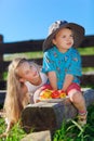 Cute blond little girl and boy playing with fruits Royalty Free Stock Photo