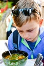 Child eating a soup Royalty Free Stock Photo