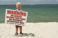 Cute Blonde Boy Happy The Beach Has Been Cleaned A Royalty Free Stock Photo