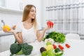 Cute Blonde Girl Choosing Which Bell Pepper to Eat