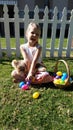 Smiling blonde girl with Easter egg basket