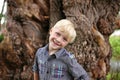 Cute Blonde Hair Blue Eyed Boy Child Outside Smiling in Nature Royalty Free Stock Photo