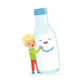 Cute blonde little boy and funny milk bottle with smiling human face playing and having fun, healthy childrens food Royalty Free Stock Photo