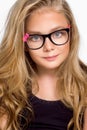 Cute blonde little girl in glasses on a white background in the