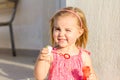 A cute blonde little gir, blowing soap bubbles Royalty Free Stock Photo