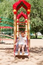 Little girl is sliding at playground Royalty Free Stock Photo