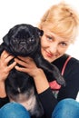 Cute blonde with a pug puppy Royalty Free Stock Photo