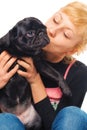 Cute blonde with a pug puppy Royalty Free Stock Photo