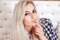 Cute blonde woman with blue eyes looking at camera Royalty Free Stock Photo