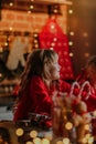 Cute blondie little girl roll out the dough for Christmas cookies