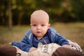 Cute blue-eyed baby boy lying on the pillow Royalty Free Stock Photo