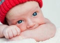 Cute blue-eyed infant with wide eyes otkoytymi Royalty Free Stock Photo