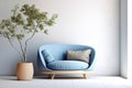 Cute blue loveseat sofa or snuggle chair and pot with branch. Interior design of modern living room with white wall with copy