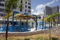 Cute blue and yellow restaurant in the open air near the roadway