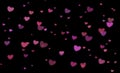 Bokeh hearts on black background. lots of little hearts. Romance. Backgrounds for lovers. Valentine`s day.