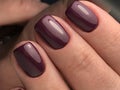 Cute Bordeaux nails with gel polish Royalty Free Stock Photo